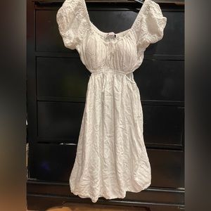 off shoulder white dress with side openings and built in padding